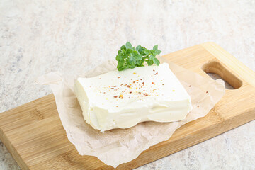 Greek Feta cheese over board
