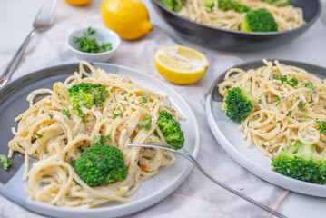 lemon spaghetti with green broccoli on a table