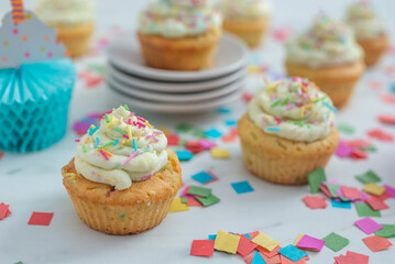sprinkled vanilla cupcakes