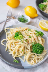 lemon spaghetti with green broccoli on a table