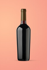 A bottle of red wine isolated on a orange background for mockup presentation projects.