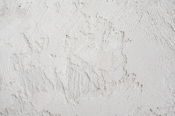 Fototapeta premium artistic plaster on a gray and white wall. Repairs. elements of wall decor. copy space. texture. background.