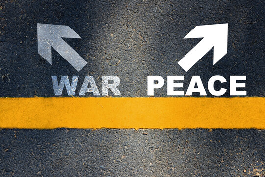 War and peace written with yellow line and white arrow on asphalt road. Conflict concept