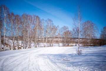 Winter view on the frozen river Tom in the vicinity of the Siberian city of Kemerovo