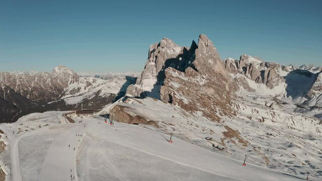 dolly back drone shot over Seceda ski slope Italian dolomites