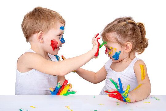 Small children draw on each other with finger paints on a white background