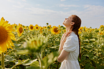 woman with two pigtails in a field of sunflowers unaltered