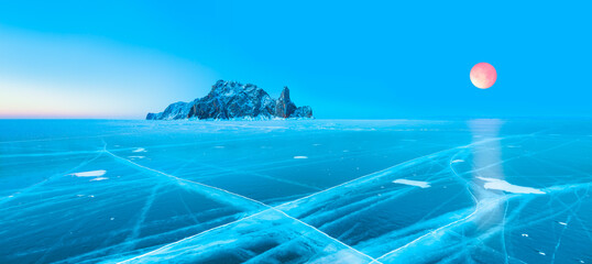 Fototapeta na wymiar Ogoy island on winter Baikal lake with transparent cracked blue ice - Baikal, Siberia, Russia 