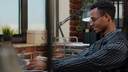 Company employee looking at laptop screen to plan career success, working on business development...