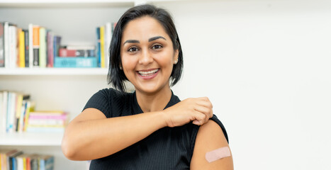 Beautiful latin american mature woman with plaster after vaccination