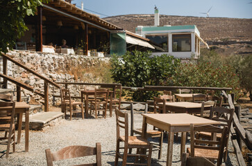 Fototapeta na wymiar Restaurant in the mountains. Delicious local Greek cuisine, connect with nature and truly appreciate farm-to-table experience of being served with freshly prepared dishes using only local ingredients