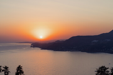 Fototapeta premium Beautiful abstract nature background with sea orange sunset on the coastline