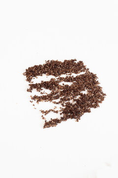 Brown texture scrub with cocoa coconut and coffee on white background. spa and home care concept, beauty procedures, vertical photo