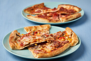 Pizza slices on blue background
