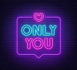 Only You neon lettering on brick wall background.