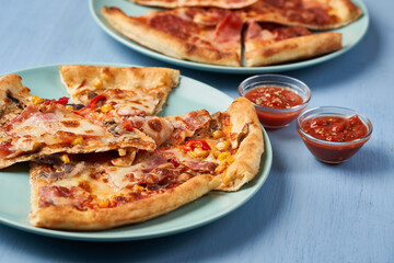 Pizza slices on blue background