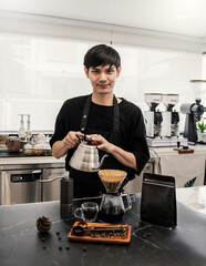 Startup successful small business owner sme handsome asian man drip hot water in to filter paper coffee slow bar in cafe. Portrait young man barista cafe owner SME entrepreneur blogger business