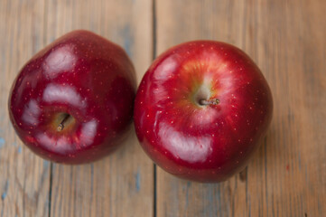 Two Bright Red and Ready to eat  Apple in Rustic Barn Setting with Old Wood Boards and room or space for copy, text, your words.