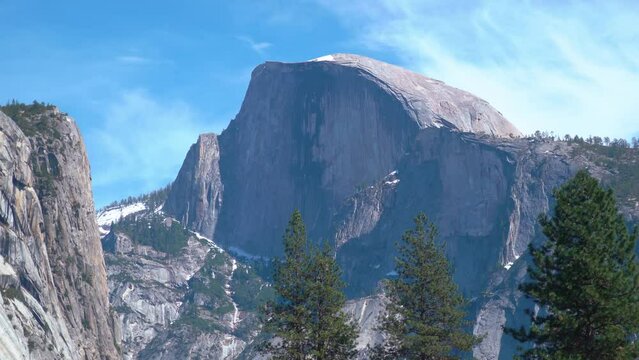 Beautiful Half Dome Mountain with snow on the peak lighting by sun in summer - California,Usa