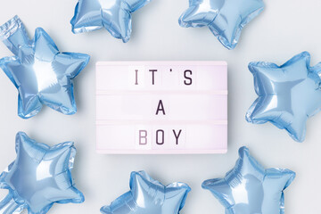 Its a boy - quote. Frame made of blue star foil balloons and lightbox.
