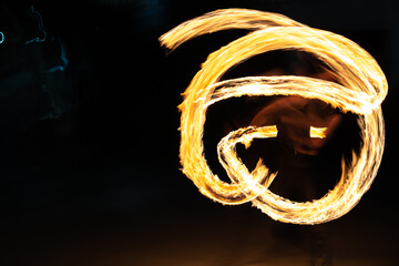 fire fire show, a night performance with a burning fire. flames in the night.