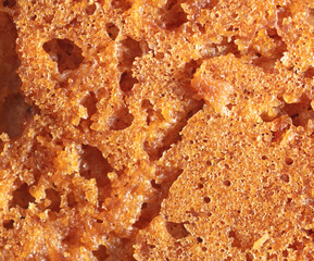 Crust on ruddy cookies as an abstract background.