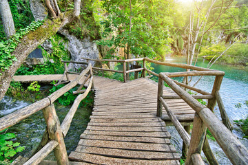 The wooden jetty over the the waterfalls by the Milino Jezero lake. Plitvice Lakes National Park in Croatia in the Lika region.