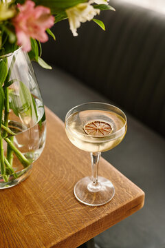 fresh cocktail with white wine stands on the table, vertical image
