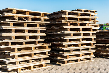 Empty pallets at a construction site. Reuse of wooden pallets in construction.