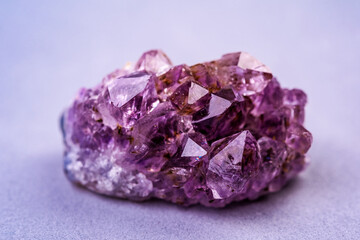 Amethyst cluster, quartz crystal  on pink background. Crystals for esoteric  practice, recreation and meditation.