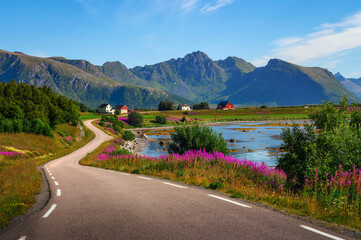 Scenic coastal road through villages and mountains on Lofoten islands in Norway