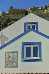 sitio of nazar&eacute; and facade of a old fischerman house in Nazar&eacute;, Portugal