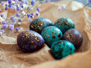 Macro vision of colorful eggs with with golden splashes for Easter. Easter celebration