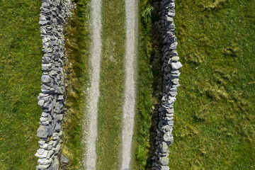 Small country road between stone wall. Inishmore, Aran islands, county Galway, Ireland. Top down...