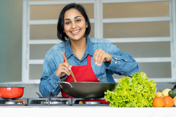 Mature latin american woman preparing vegetarian food