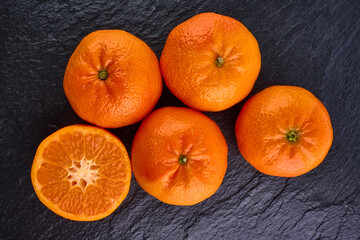 Fresh tangerine on stone background.