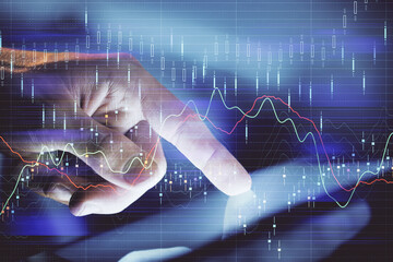 Multi exposure of man's hands holding and using a phone and financial chart drawing. Market...