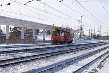 Naklejka premium Heavy equipment for work on the railway. Train for the repair of electrical networks.