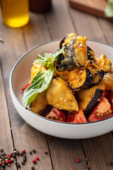 Bowl of sweet chili crispy battered eggplants salad