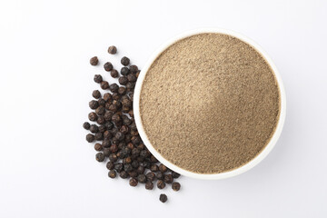 Indian spices - black pepper powder,Black pepper corns scattered on white background and Black pepper Powder on Glass bowl isolated on white background.
