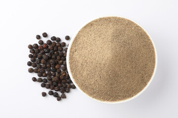 Indian spices - black pepper powder,Black pepper corns scattered on white background and Black pepper Powder on Glass bowl isolated on white background.