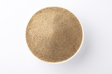Indian spices - black pepper powder,Black pepper corns scattered on white background and Black pepper Powder on Glass bowl isolated on white background.