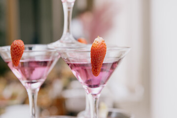 Pyramid of Champagne Glasses with Color Cocktails.