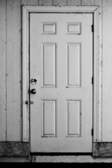 old wooden door in black and white grayscale 