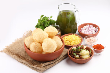 Panipuri or Golgappa is a popular street snack from India. It's a round, hollow puri filled with a mixture of flavoured water and other chat items © SMD IMAGES