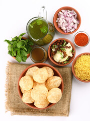 Panipuri or Golgappa is a popular street snack from India. It's a round, hollow puri filled with a mixture of flavoured water and other chat items