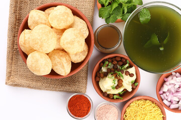 Panipuri or Golgappa is a popular street snack from India. It's a round, hollow puri filled with a mixture of flavoured water and other chat items