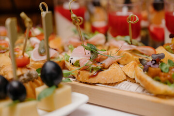 Cheese canapes with wine on table. Catering.