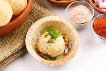 Panipuri or Golgappa is a popular street snack from India. It's a round, hollow puri filled with a mixture of flavoured water and other chat items © SMD IMAGES