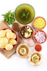 Obraz na płótnie Canvas Panipuri or Golgappa is a popular street snack from India. It's a round, hollow puri filled with a mixture of flavoured water and other chat items